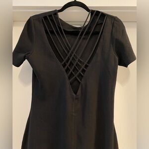 Outlander, form fitting, stretchy, criss cross back  black dress.